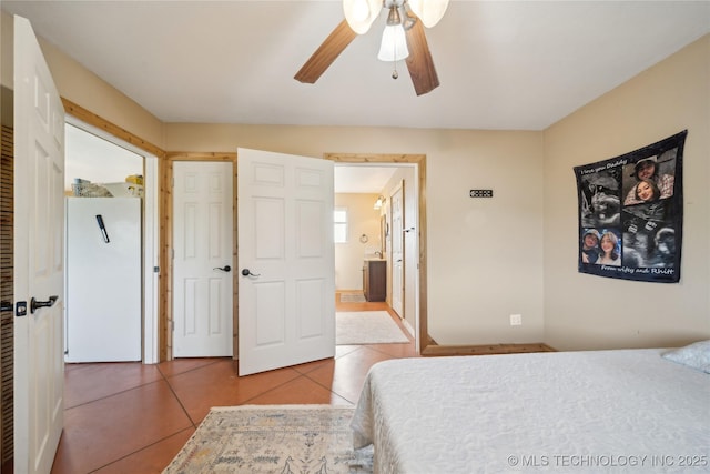 1200 S Oak Grove Rd, Cushing, OK 74023 - bedroom featuring tile patterned floors, ensuite bathroom, and ceiling fan