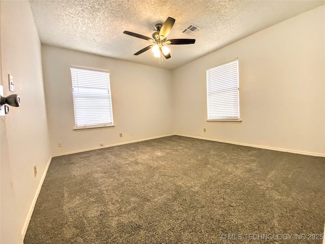 7205 S Date Pl, Broken Arrow, OK 74011 - spare room with a textured ceiling, dark colored carpet, a ceiling fan, and baseboards