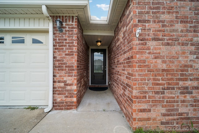 510 S Creek St, Skiatook, OK 74070 - property entrance featuring brick siding and a garage