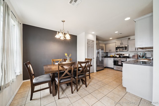 510 S Creek St, Skiatook, OK 74070 - dining area featuring light tile patterned floors, recessed lighting, and a chandelier