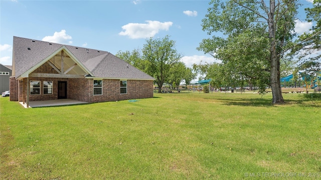 2508 W Birmingham St, Broken Arrow, OK 74011 - view of green lawn with a patio