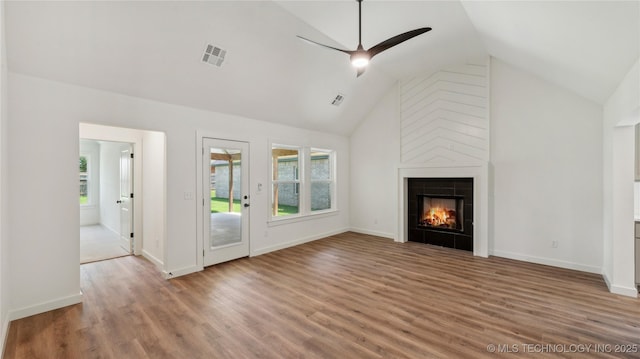 2508 W Birmingham St, Broken Arrow, OK 74011 - unfurnished living room with healthy amount of natural light, ceiling fan, wood finished floors, a fireplace, and high vaulted ceiling