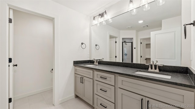 2508 W Birmingham St, Broken Arrow, OK 74011 - bathroom featuring double vanity, a shower stall, and tile patterned floors