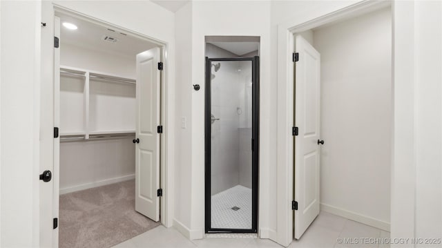 2508 W Birmingham St, Broken Arrow, OK 74011 - bathroom with a shower stall, a walk in closet, and tile patterned flooring
