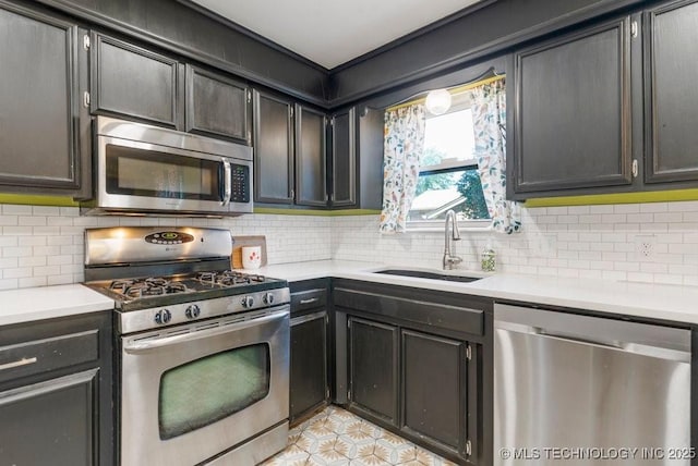 412 W Los Angeles St, Broken Arrow, OK 74011 - kitchen featuring appliances with stainless steel finishes, a sink, light countertops, and tasteful backsplash