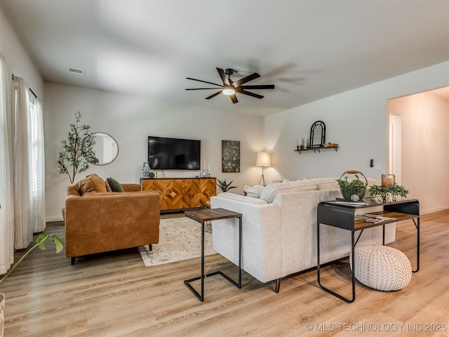 7221 S Indianwood Ave, Broken Arrow, OK 74011 - living room featuring a ceiling fan and light wood-style flooring