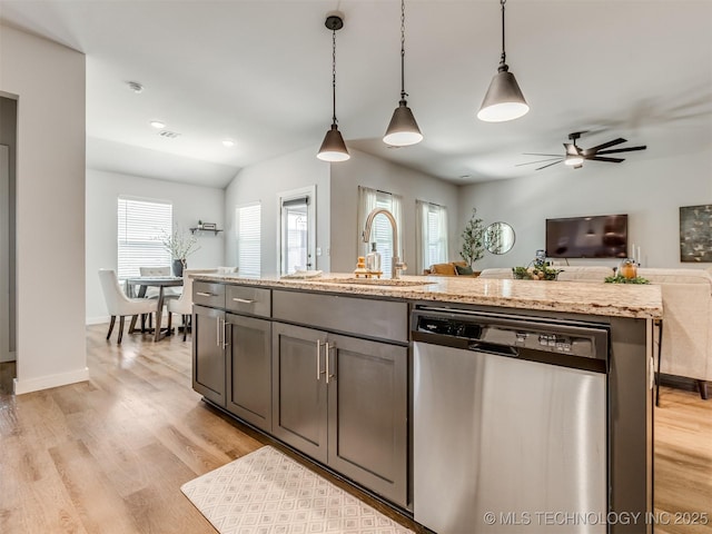 7221 S Indianwood Ave, Broken Arrow, OK 74011 - kitchen featuring dishwasher, open floor plan, a sink, pendant lighting, and light wood-style flooring