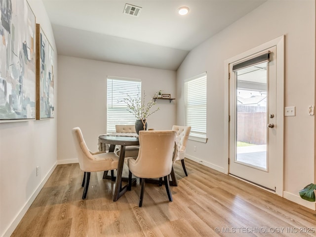 7221 S Indianwood Ave, Broken Arrow, OK 74011 - dining area featuring light wood finished floors, lofted ceiling, and baseboards
