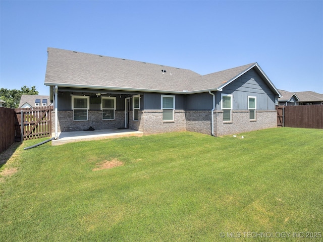 7221 S Indianwood Ave, Broken Arrow, OK 74011 - back of property with brick siding, a patio area, and a shingled roof