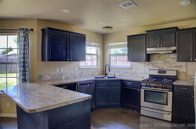 11968 S 270th E Ave, Coweta, OK 74429 - kitchen with stainless steel appliances, under cabinet range hood, a peninsula, light countertops, and backsplash