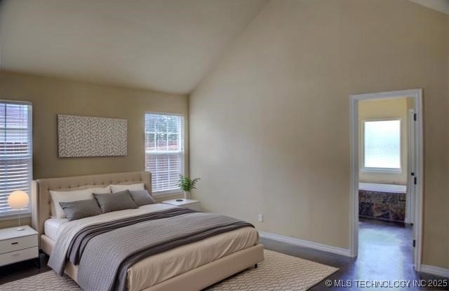 11968 S 270th E Ave, Coweta, OK 74429 - bedroom with baseboards and high vaulted ceiling