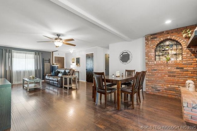 1138 N Gum Ave, Broken Arrow, OK 74012 - dining space with brick wall, a ceiling fan, and wood finished floors