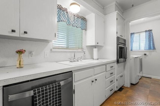 1138 N Gum Ave, Broken Arrow, OK 74012 - kitchen featuring separate washer and dryer, a sink, oven, white cabinetry, and crown molding