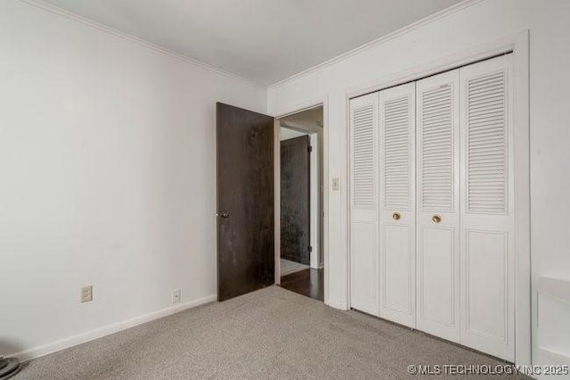 1138 N Gum Ave, Broken Arrow, OK 74012 - unfurnished bedroom featuring crown molding, a closet, and carpet
