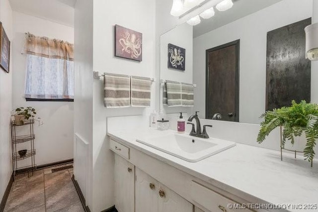 1138 N Gum Ave, Broken Arrow, OK 74012 - bathroom featuring vanity and baseboards