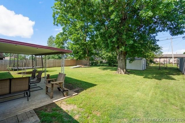 1138 N Gum Ave, Broken Arrow, OK 74012 - view of yard featuring a trampoline and a patio area