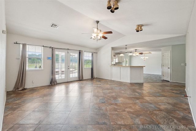 385077 E 1160th Rd, Weleetka, OK 74880 - unfurnished living room featuring french doors, lofted ceiling, a ceiling fan, baseboards, and a chandelier