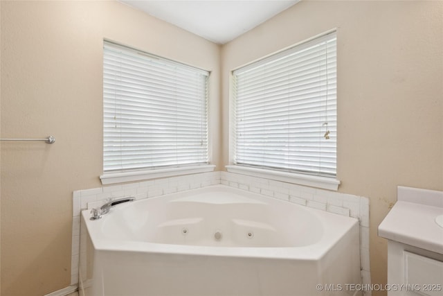 385077 E 1160th Rd, Weleetka, OK 74880 - bathroom featuring a jetted tub, plenty of natural light, and vanity