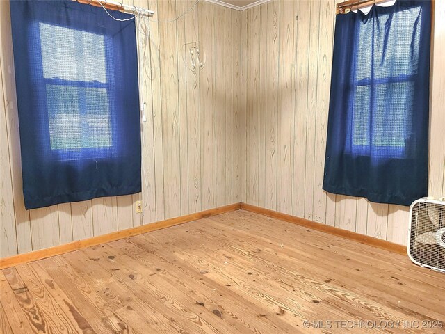 1950 Cedar Bluff Rd, Fort Gibson, OK 74434 - unfurnished room with wood finished floors, baseboards, and wooden walls