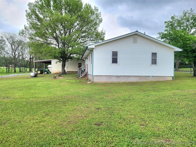 1950 Cedar Bluff Rd, Fort Gibson, OK 74434 - view of property exterior with entry steps, a carport, and a lawn
