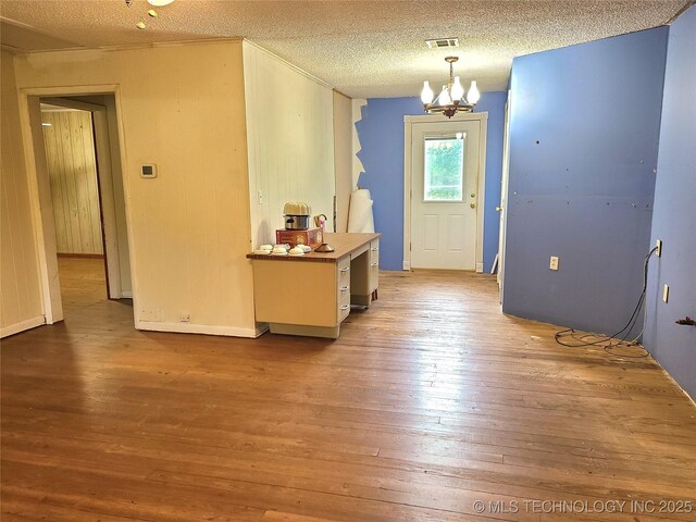 1950 Cedar Bluff Rd, Fort Gibson, OK 74434 - foyer featuring hardwood / wood-style floors, a chandelier, a textured ceiling, and baseboards