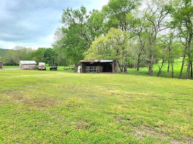 1950 Cedar Bluff Rd, Fort Gibson, OK 74434 - view of grassy yard with a pole building and an outbuilding