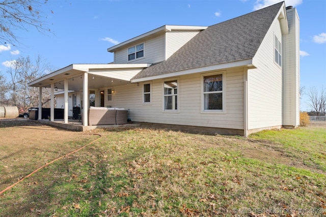 11818 N Harvard Ave, Skiatook, OK 74070 - rear view of house featuring roof with shingles, an outdoor living space, a lawn, and a chimney