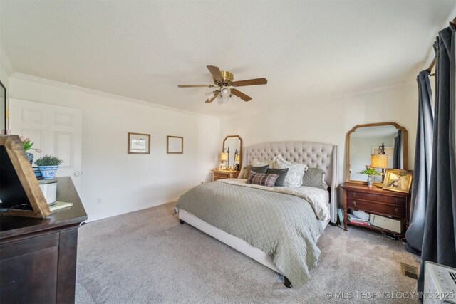 11818 N Harvard Ave, Skiatook, OK 74070 - carpeted bedroom featuring ornamental molding and a ceiling fan