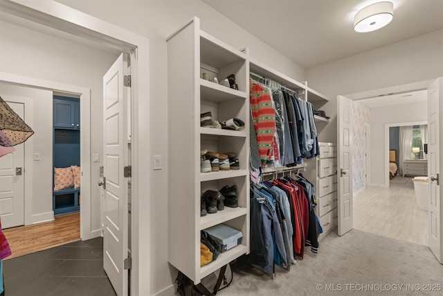 6705 S Palm Ave, Broken Arrow, OK 74011 - walk in closet featuring dark tile patterned flooring