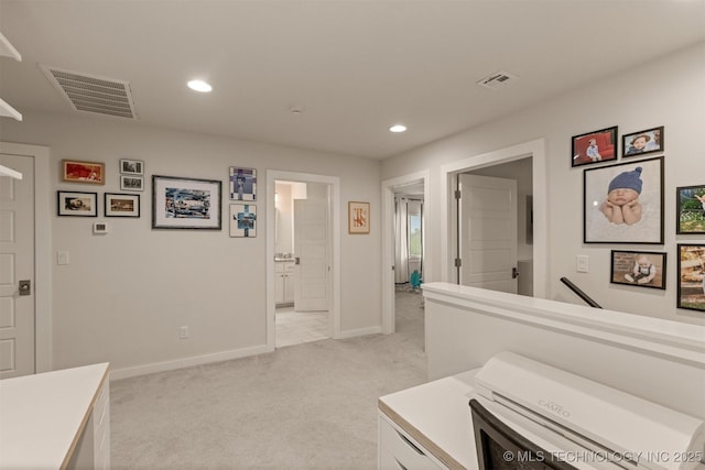 6705 S Palm Ave, Broken Arrow, OK 74011 - hallway featuring light colored carpet, recessed lighting, and baseboards