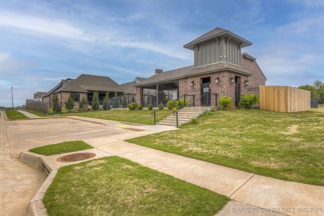 6705 S Palm Ave, Broken Arrow, OK 74011 - view of front facade featuring brick siding and board and batten siding