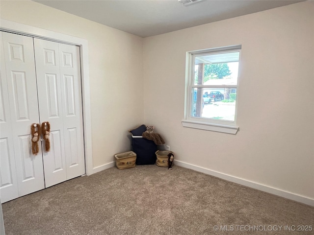 11522 E 64th St, Broken Arrow, OK 74012 - unfurnished bedroom featuring carpet, baseboards, and a closet