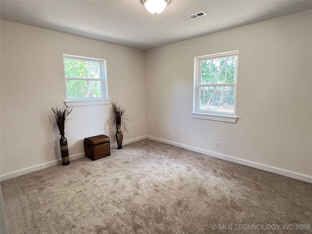 11522 E 64th St, Broken Arrow, OK 74012 - carpeted spare room featuring baseboards