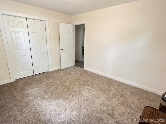 11522 E 64th St, Broken Arrow, OK 74012 - unfurnished bedroom with carpet, baseboards, and a closet