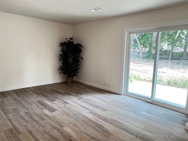 11522 E 64th St, Broken Arrow, OK 74012 - empty room featuring wood finished floors and baseboards