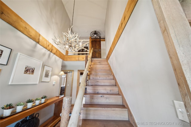 20119 E Willis Rd, Tahlequah, OK 74464 - stairway featuring a chandelier and a high ceiling
