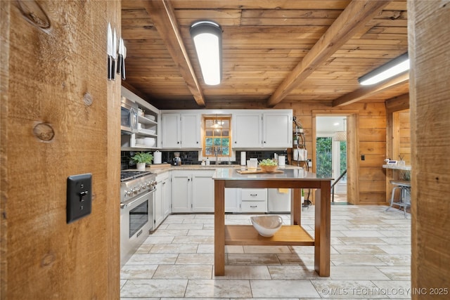 20119 E Willis Rd, Tahlequah, OK 74464 - kitchen with stainless steel range, wood ceiling with exposed beams, open shelves, white cabinets, and light countertops