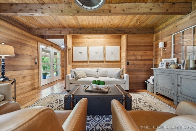 20119 E Willis Rd, Tahlequah, OK 74464 - living area with wooden walls, wood ceiling with exposed beams, french doors, and hardwood / wood-style floors