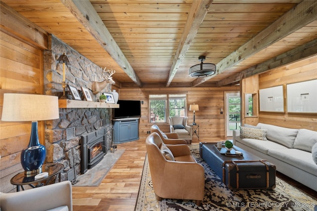 20119 E Willis Rd, Tahlequah, OK 74464 - living area with light wood-style flooring, wooden walls, and wood ceiling with exposed beams