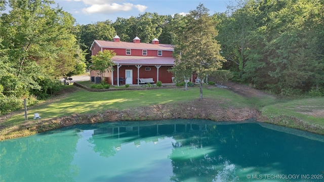 20119 E Willis Rd, Tahlequah, OK 74464 - back of house featuring a lawn, a chimney, a water view, and a wooded view