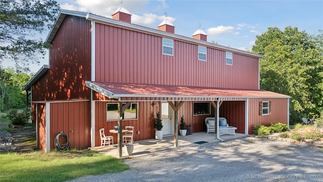 20119 E Willis Rd, Tahlequah, OK 74464 - view of front of house with a chimney and a patio area