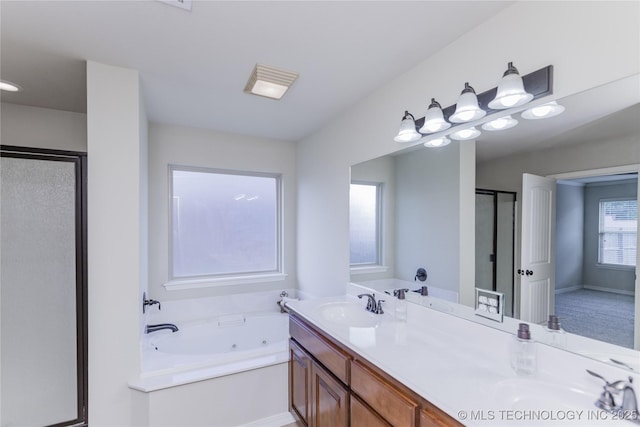 9241 N 144th E Ave, Owasso, OK 74055 - full bathroom featuring a shower stall, a jetted tub, and double vanity