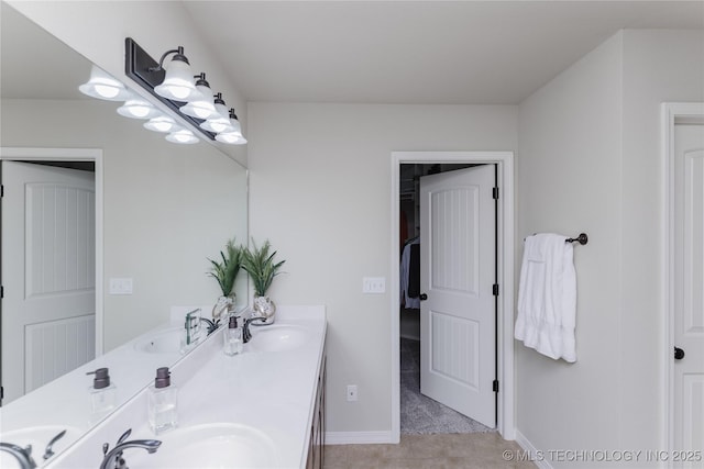 9241 N 144th E Ave, Owasso, OK 74055 - bathroom featuring double vanity and baseboards