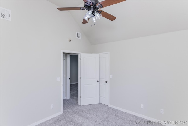 9241 N 144th E Ave, Owasso, OK 74055 - unfurnished bedroom with carpet floors, baseboards, high vaulted ceiling, and ceiling fan