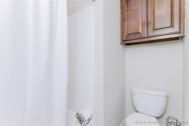9241 N 144th E Ave, Owasso, OK 74055 - bathroom with toilet and a shower with shower curtain