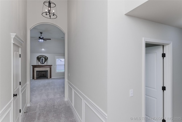 9241 N 144th E Ave, Owasso, OK 74055 - hallway with light carpet and a chandelier