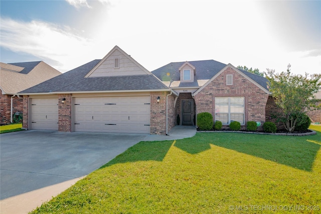 9241 N 144th E Ave, Owasso, OK 74055 - traditional-style home with a garage, brick siding, concrete driveway, a front yard, and roof with shingles