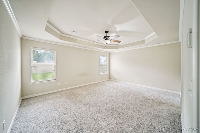 9241 N 144th E Ave, Owasso, OK 74055 - carpeted spare room with a tray ceiling, a ceiling fan, crown molding, and baseboards