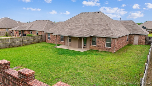 9241 N 144th E Ave, Owasso, OK 74055 - back of house featuring brick siding, a patio area, and a shingled roof