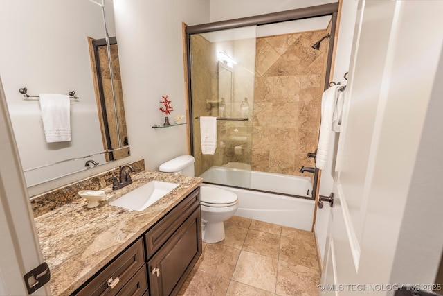 1412 E 37th St, Tulsa, OK 74105 - bathroom featuring toilet, vanity, and bath / shower combo with glass door